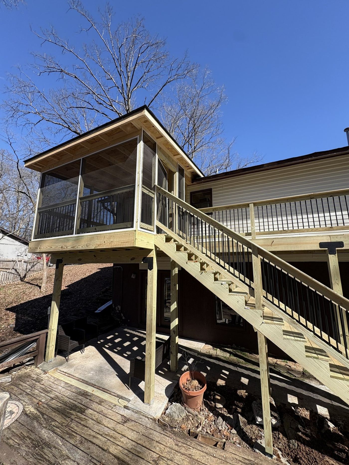 New screened-in deck and stairs built by Demo Dudes